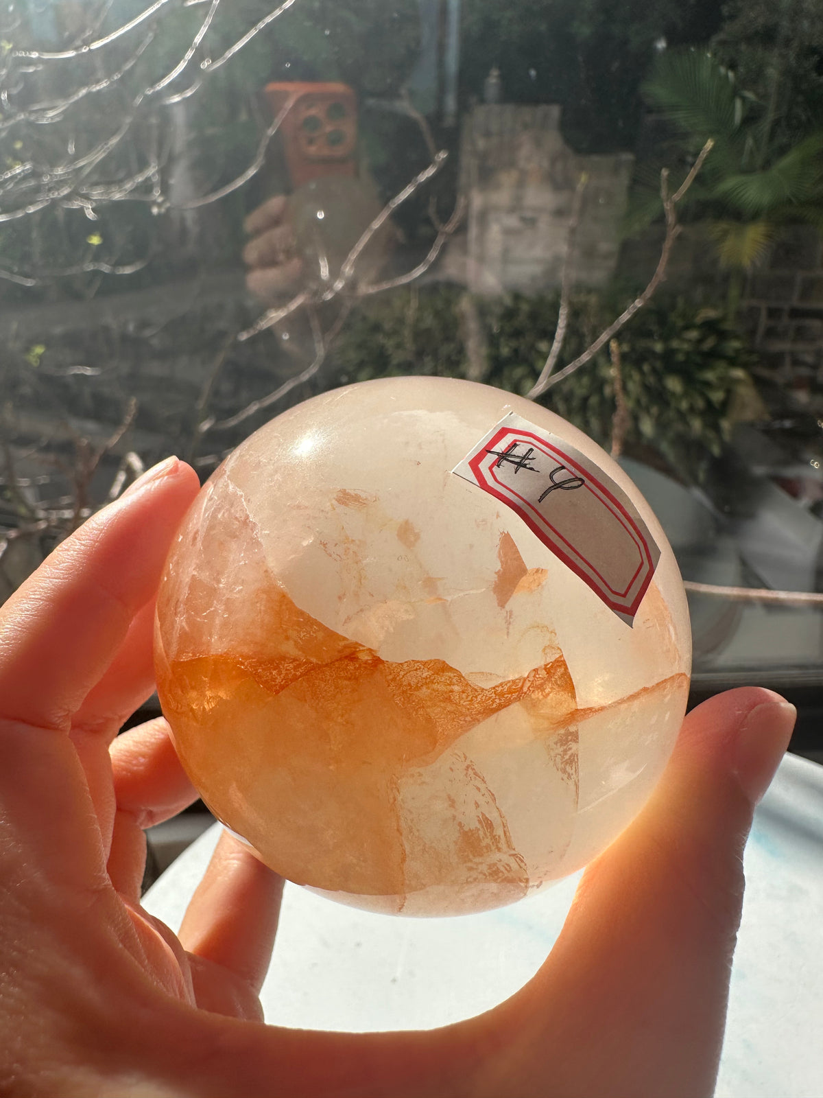 Fire Quartz sphere #4 showing red hematite inclusions and internal quartz veils, alternate view 15