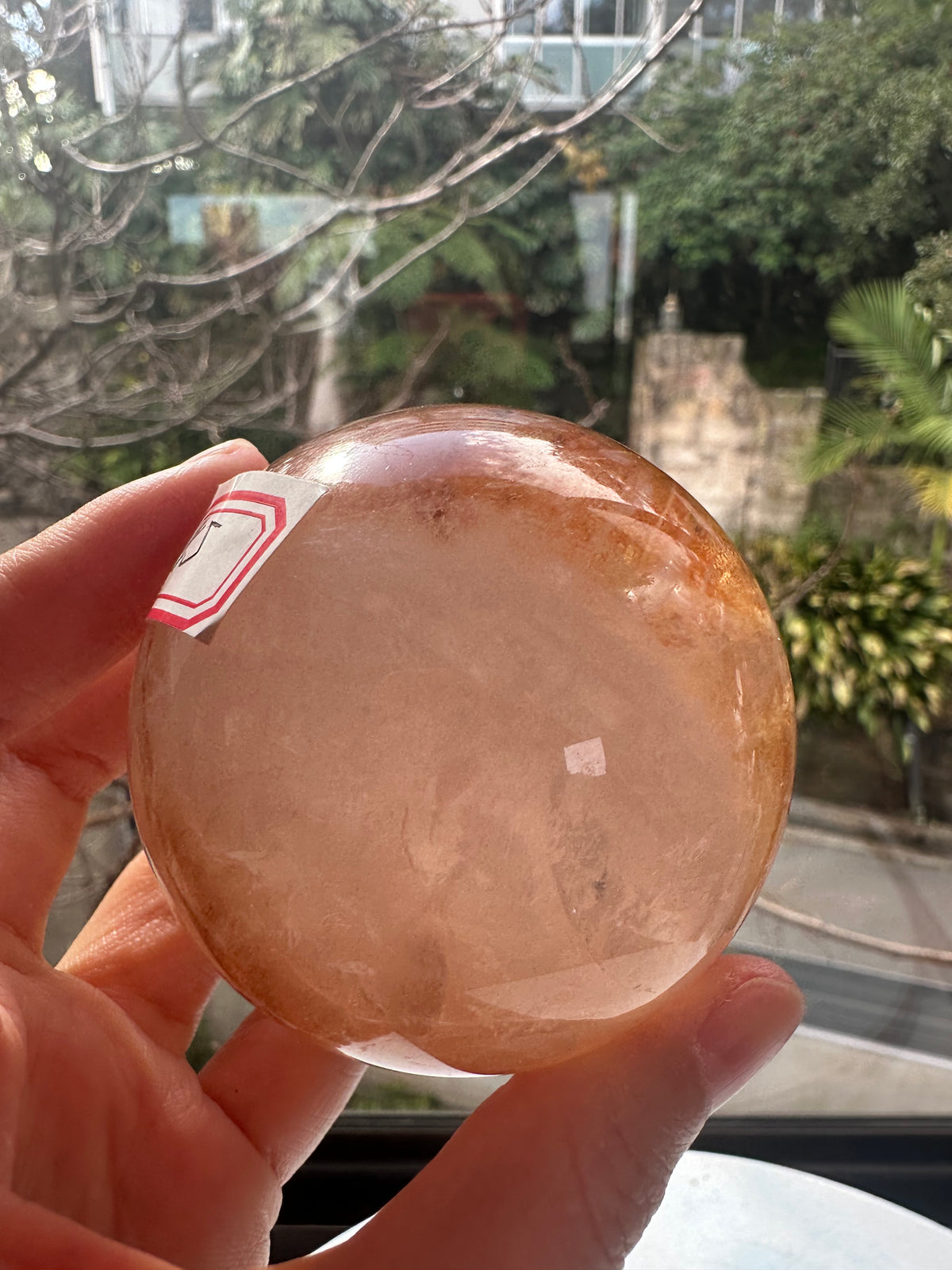Fire Quartz sphere #5 showing red hematite inclusions and internal quartz veils, alternate view 6