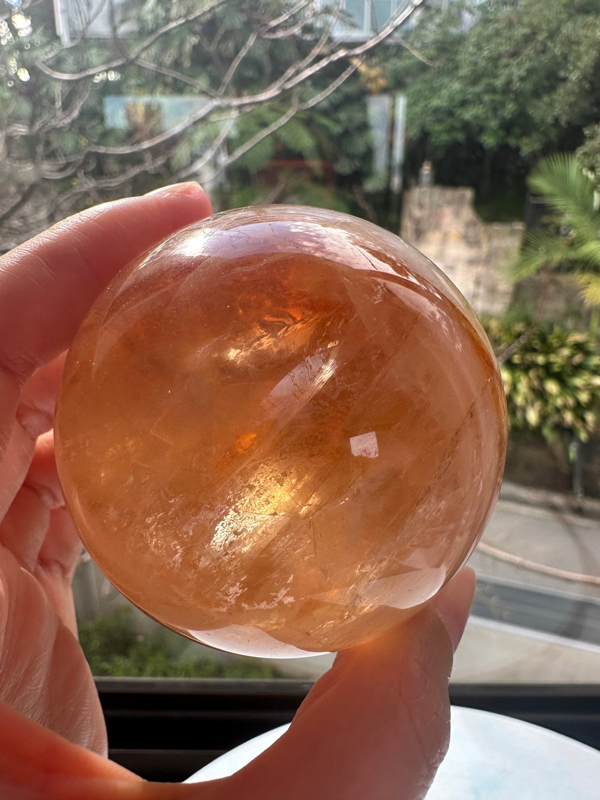 Fire Quartz sphere #5 showing red hematite inclusions and internal quartz veils, alternate view 7