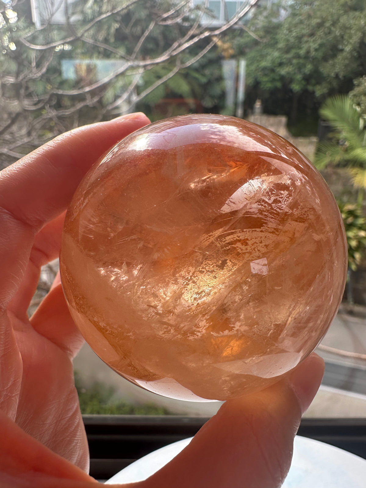Fire Quartz sphere #5 showing red hematite inclusions and internal quartz veils, alternate view 8