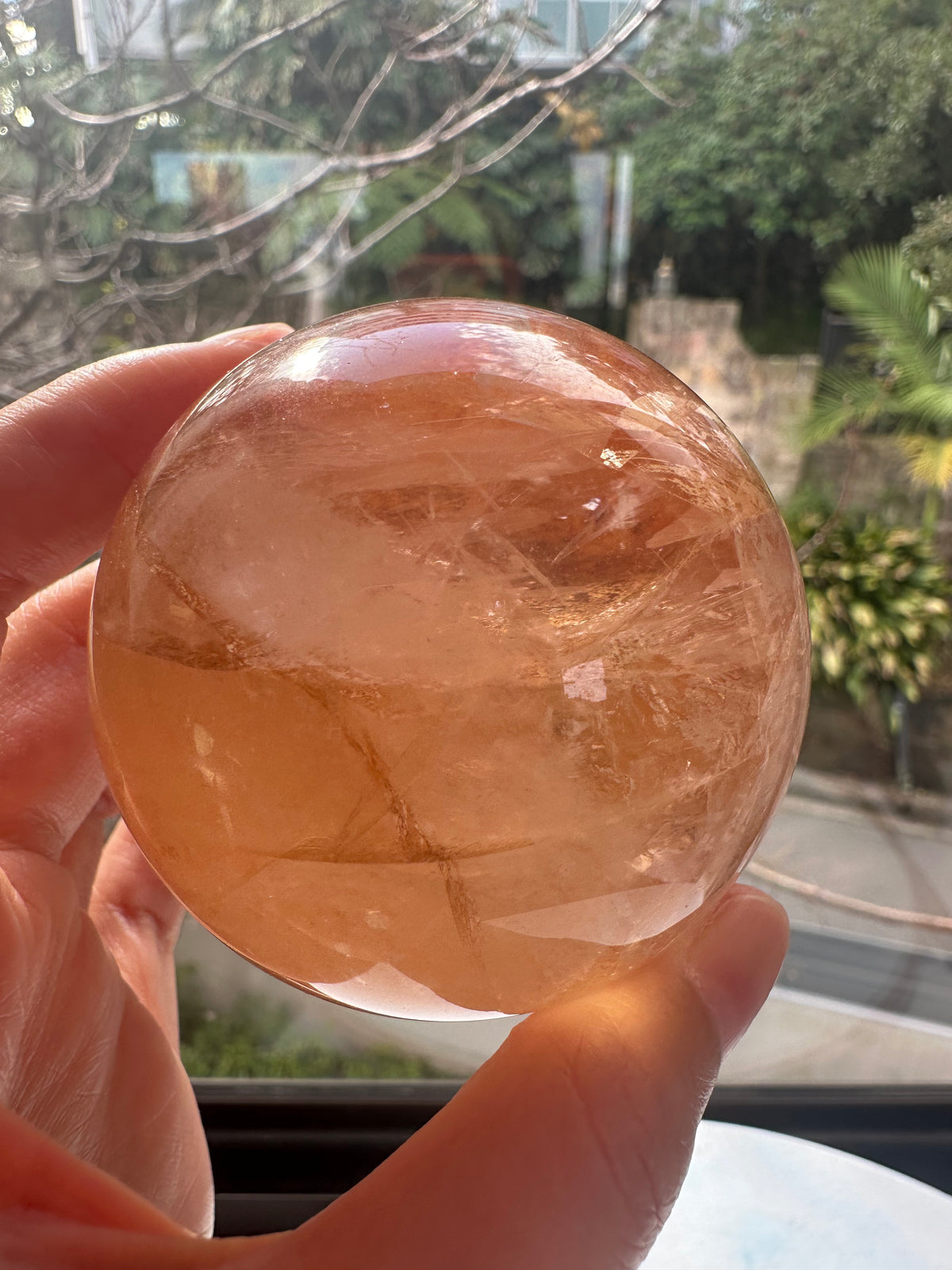 Fire Quartz sphere #5 showing red hematite inclusions and internal quartz veils, alternate view 9