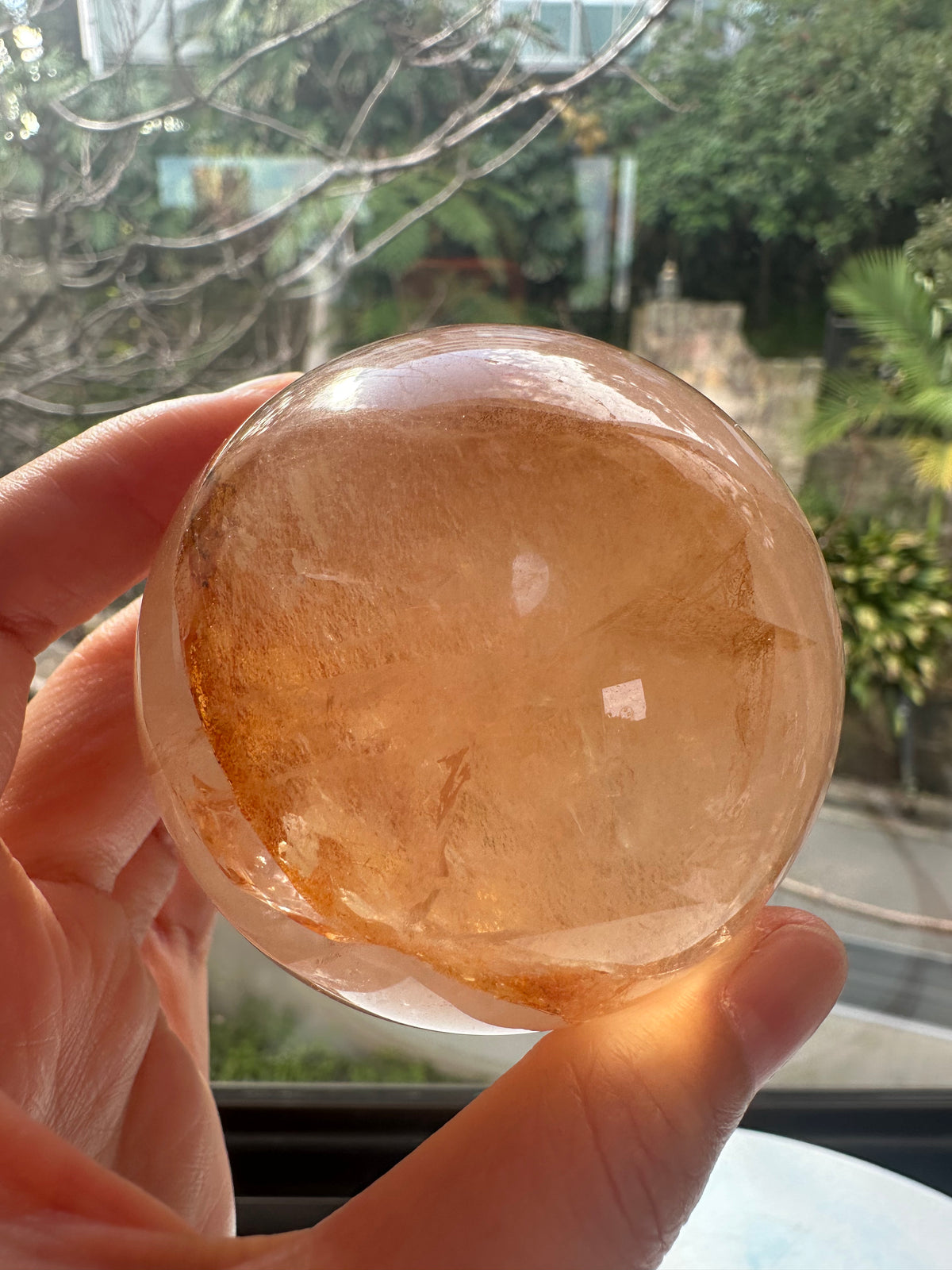 Fire Quartz sphere #5 showing red hematite inclusions and internal quartz veils, alternate view 10