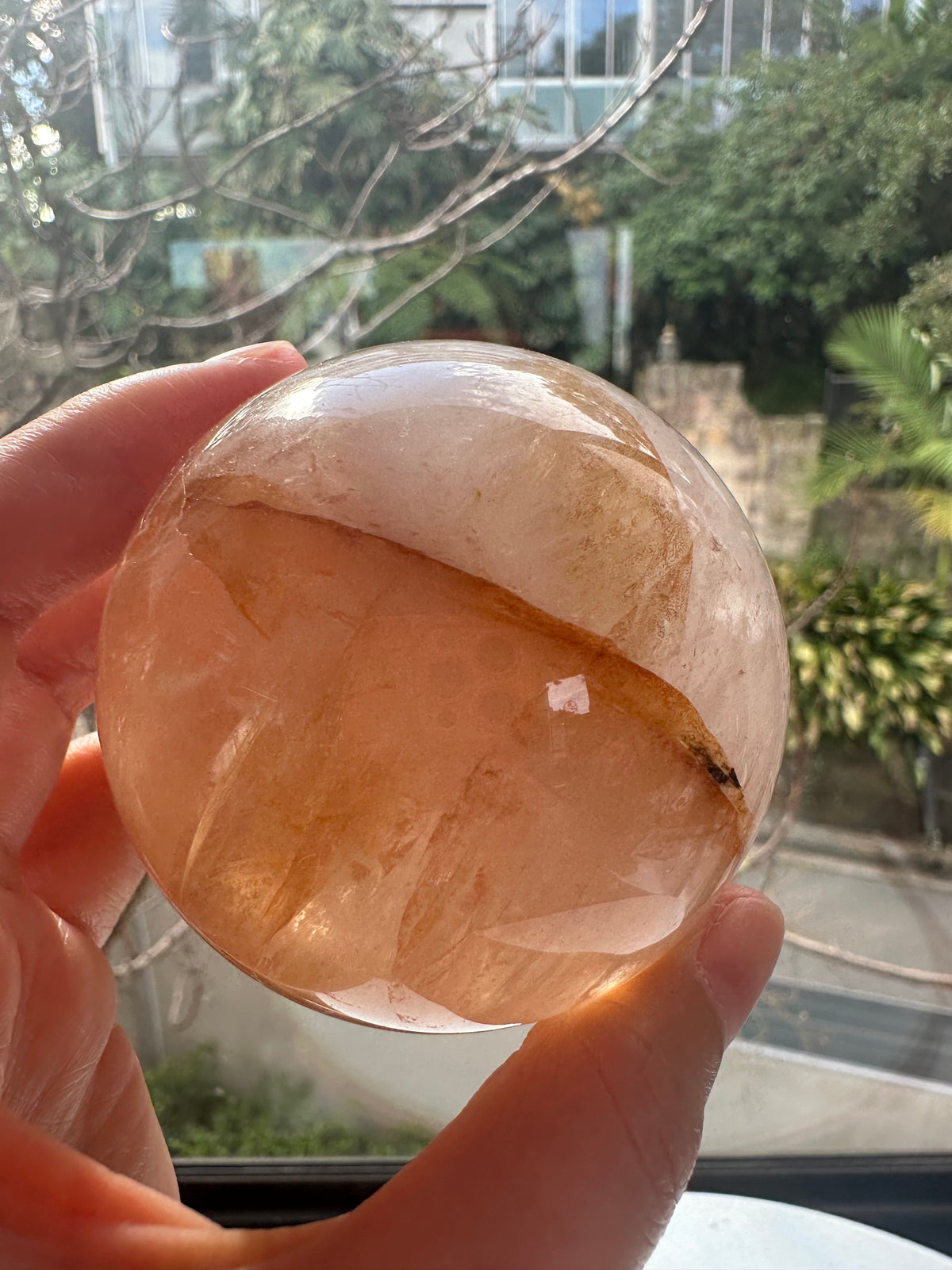 Fire Quartz sphere #5 showing red hematite inclusions and internal quartz veils, alternate view 11