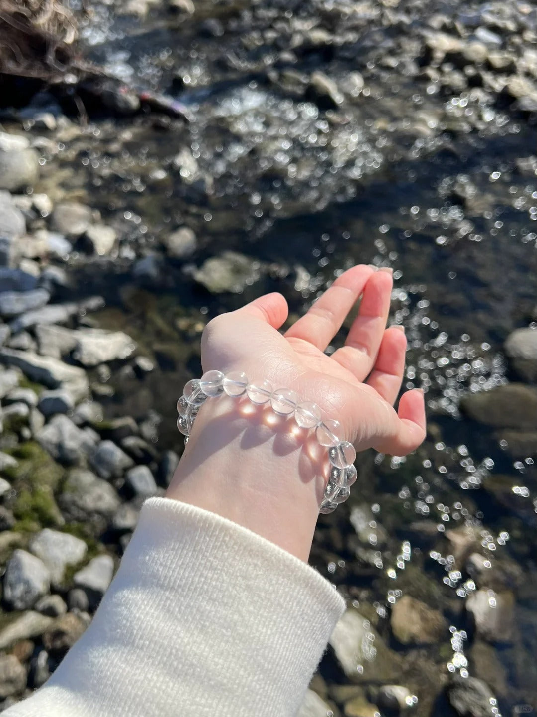 Clear Quartz crystal bracelet close-up with transparent polished beads