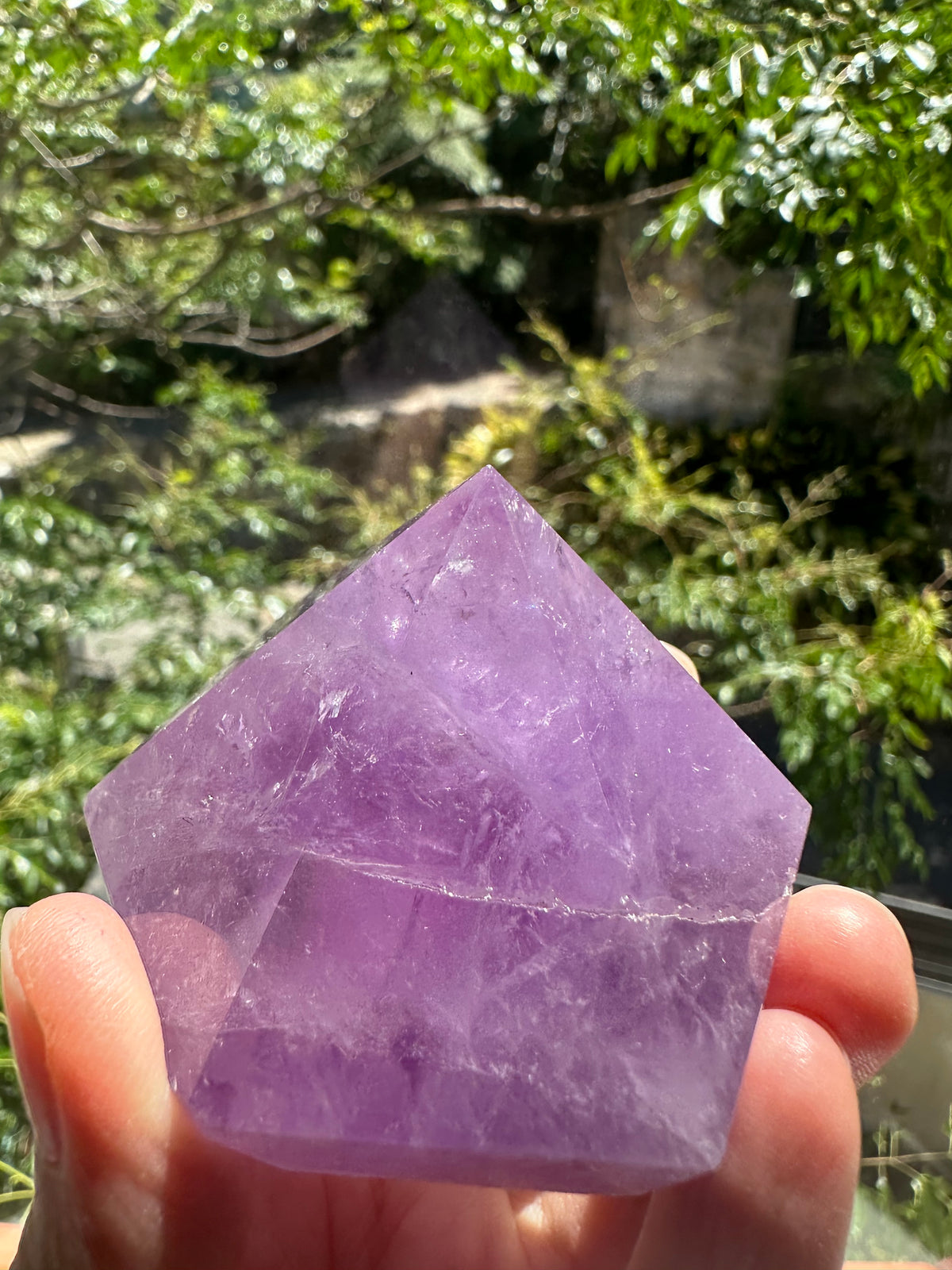 Polished Lavender Amethyst facets in natural light