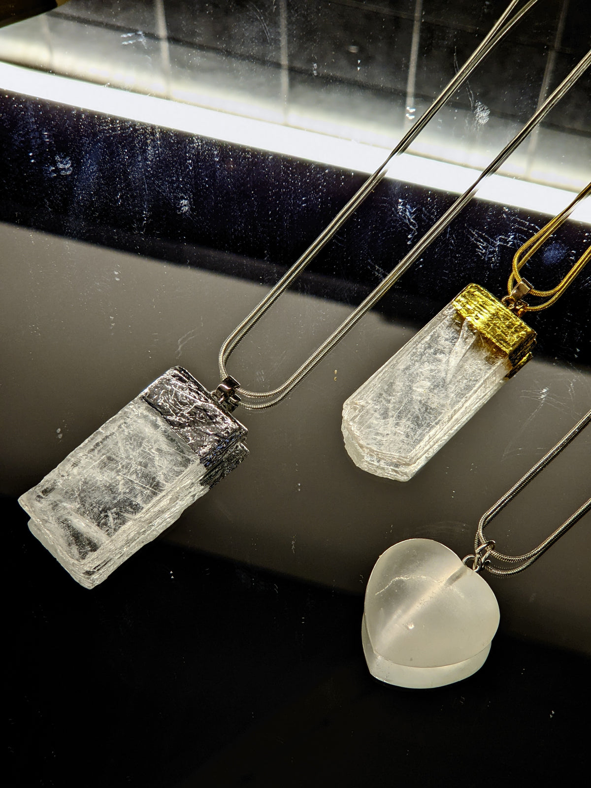 Selenite necklace product view with crystal pendant and chain
