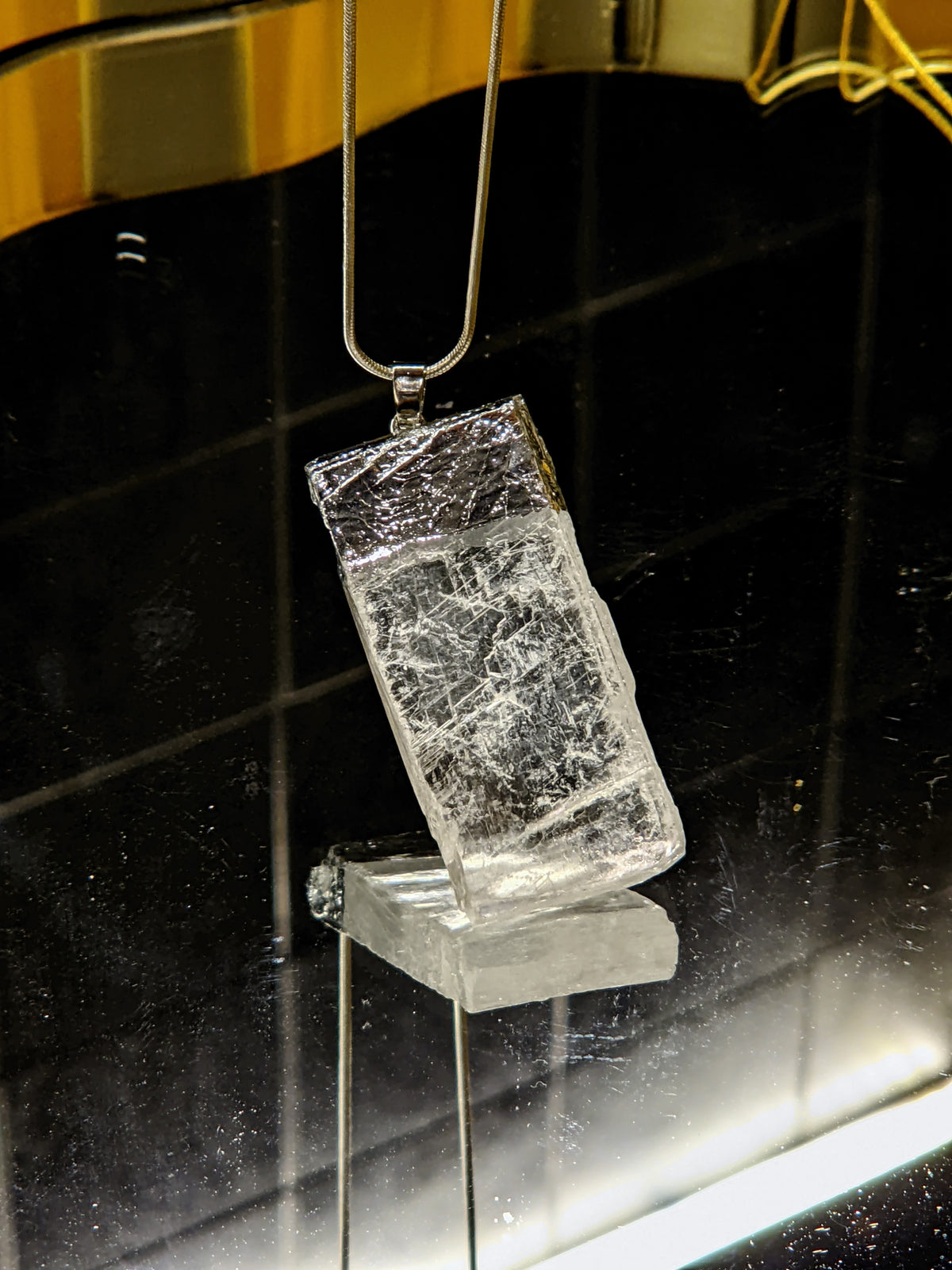 Selenite crystal necklace with polished white pendant close-up