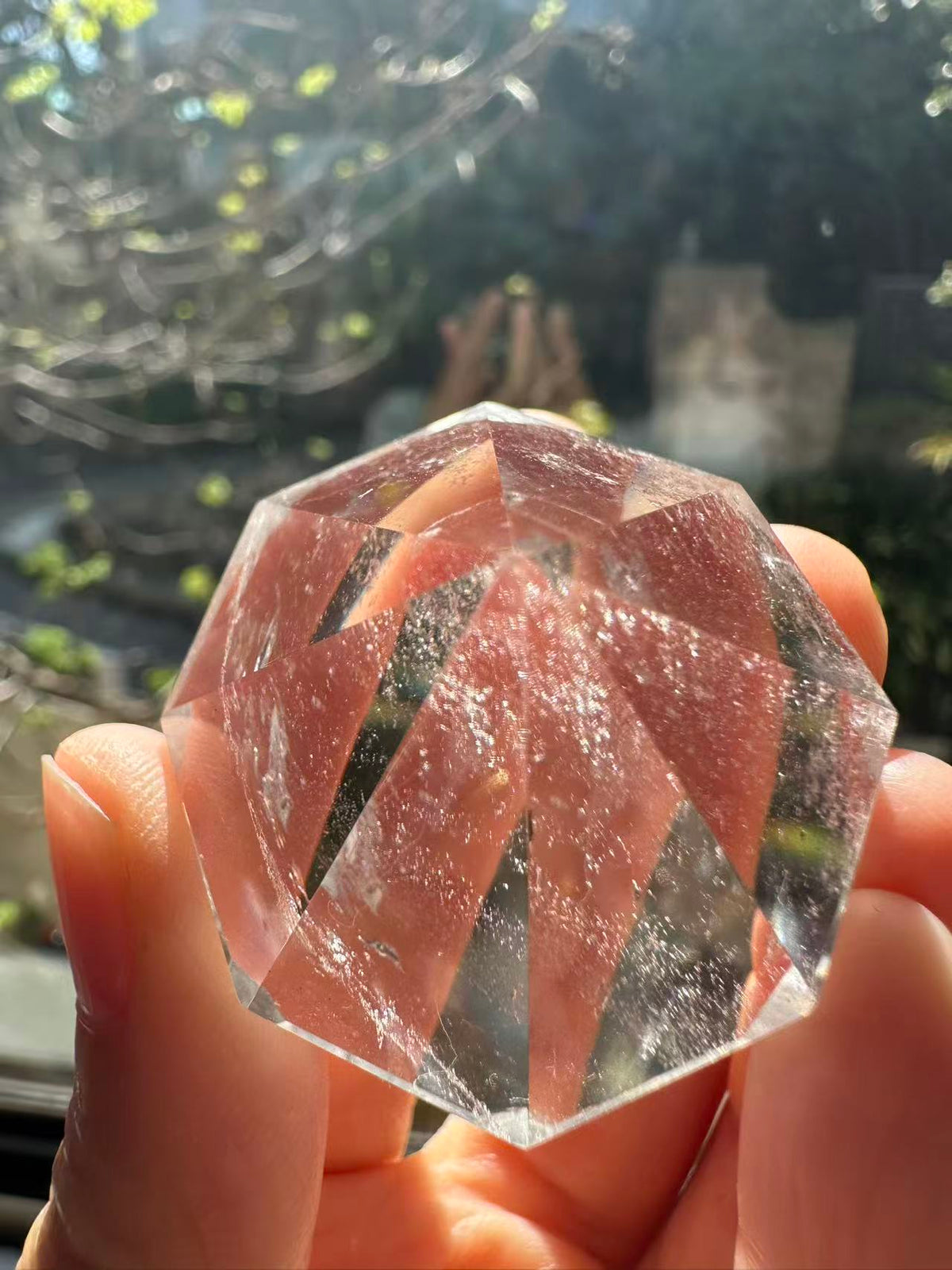 Clear Quartz diamond with light reflecting through facets