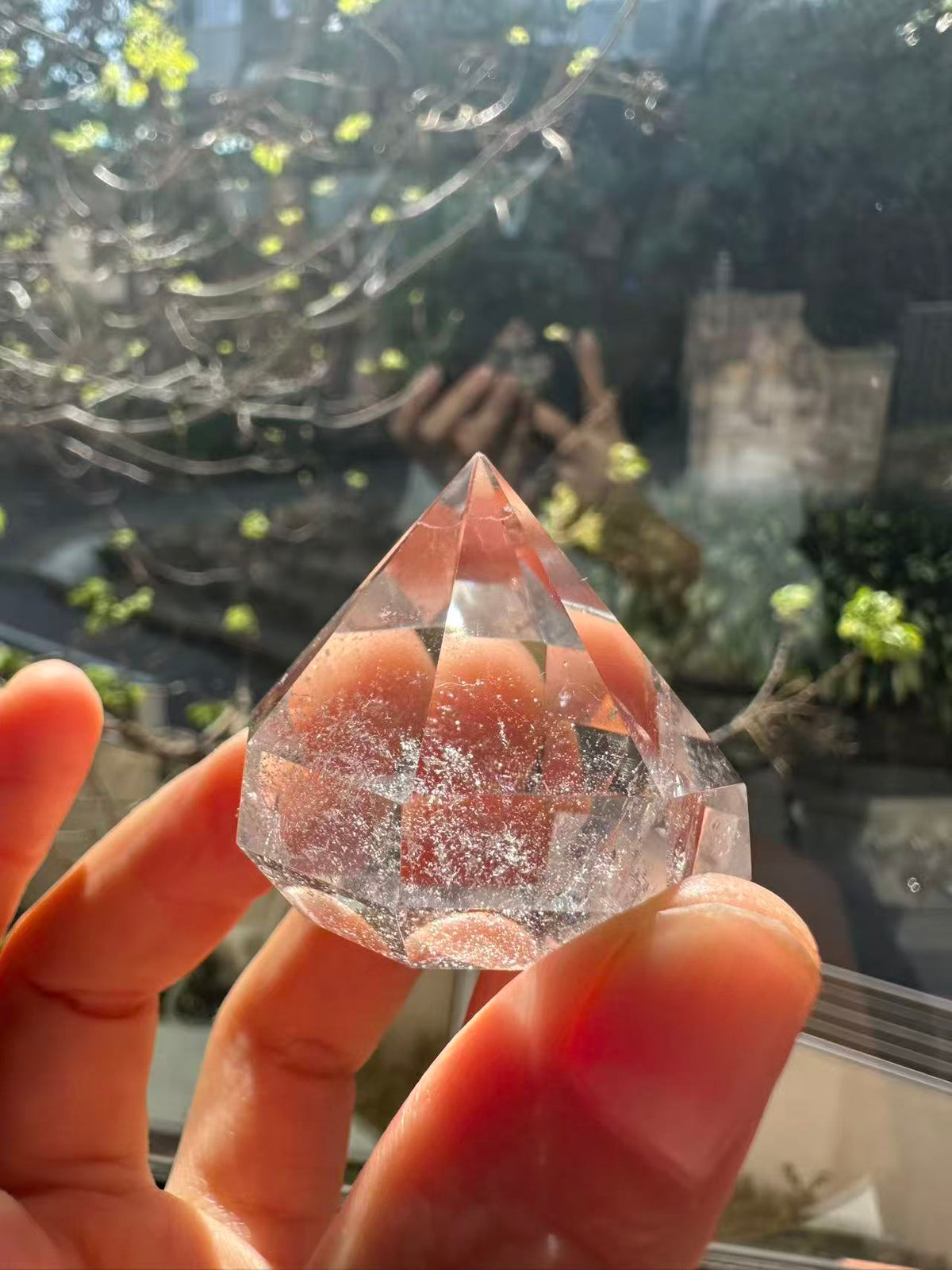 Natural faceted Clear Quartz crystal with internal inclusions