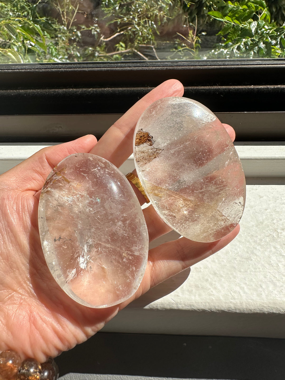 Clear Quartz palm stones showing natural variation