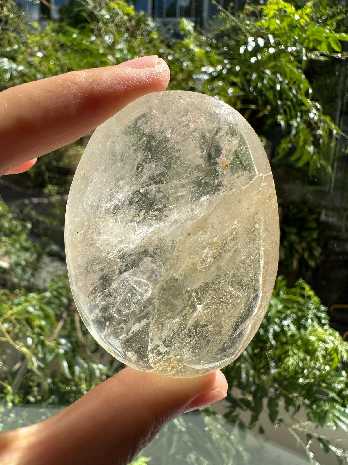 Clear Quartz palm stone size and shape example