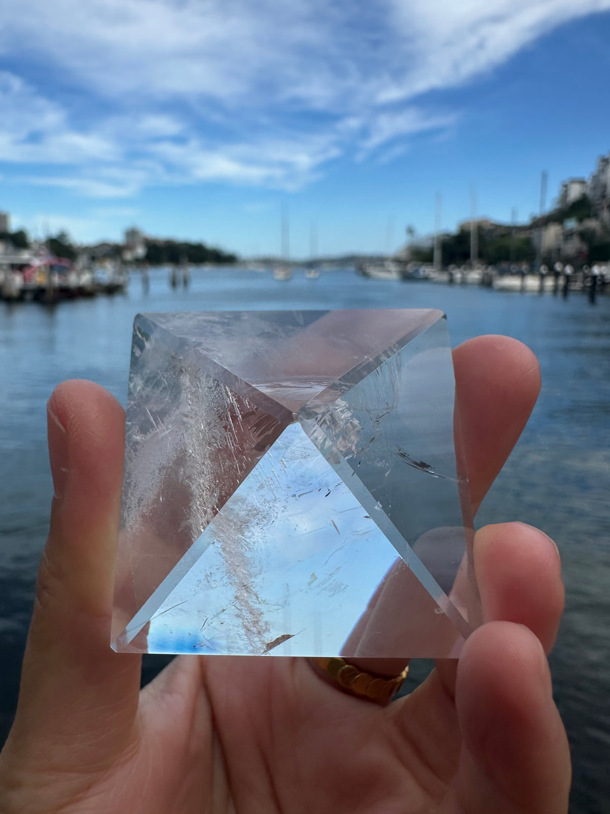 Polished Clear Quartz pyramid photographed in natural light
