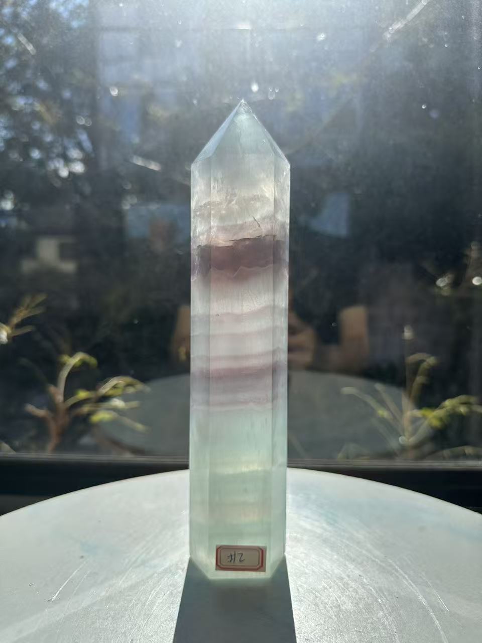  Hand-polished 22cm pale green fluorite pillar with rhythmic growth layers and a serene translucent finish, 1.1kg crystal decor for focused energy.