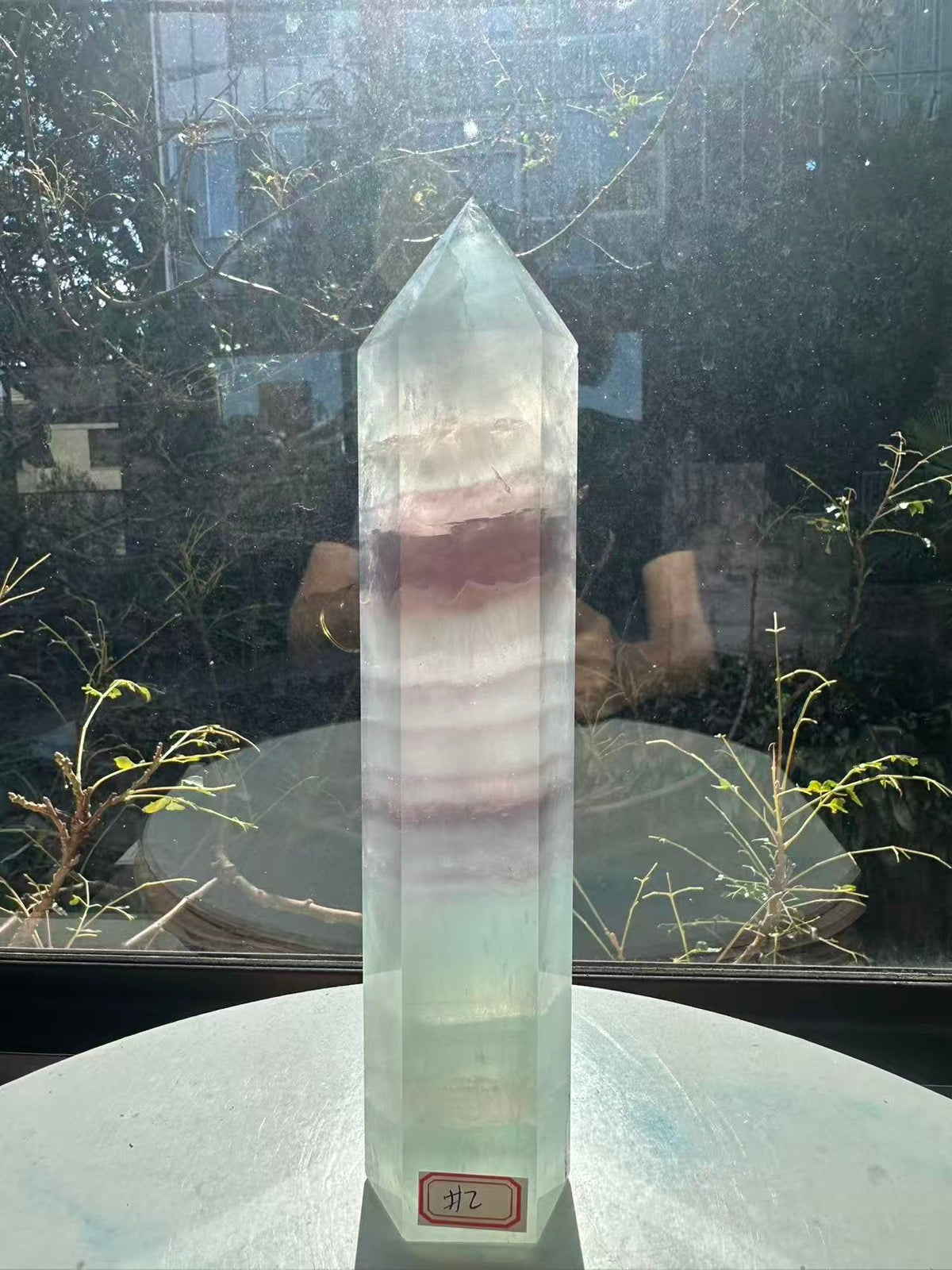  Hand-polished 22cm pale green fluorite pillar with rhythmic growth layers and a serene translucent finish, 1.1kg crystal decor for focused energy.