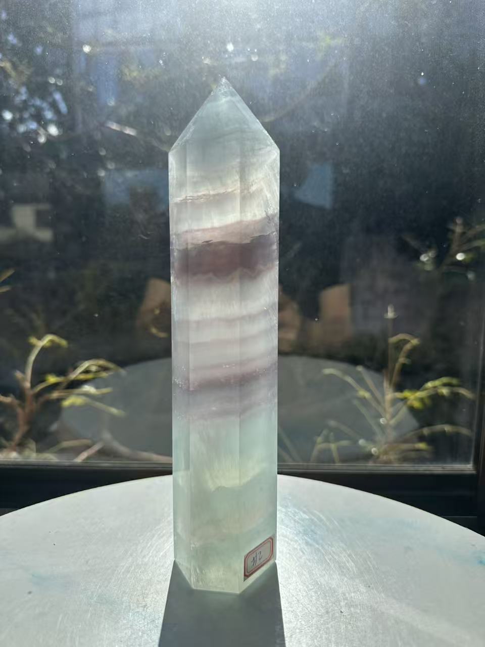  Hand-polished 22cm pale green fluorite pillar with rhythmic growth layers and a serene translucent finish, 1.1kg crystal decor for focused energy.