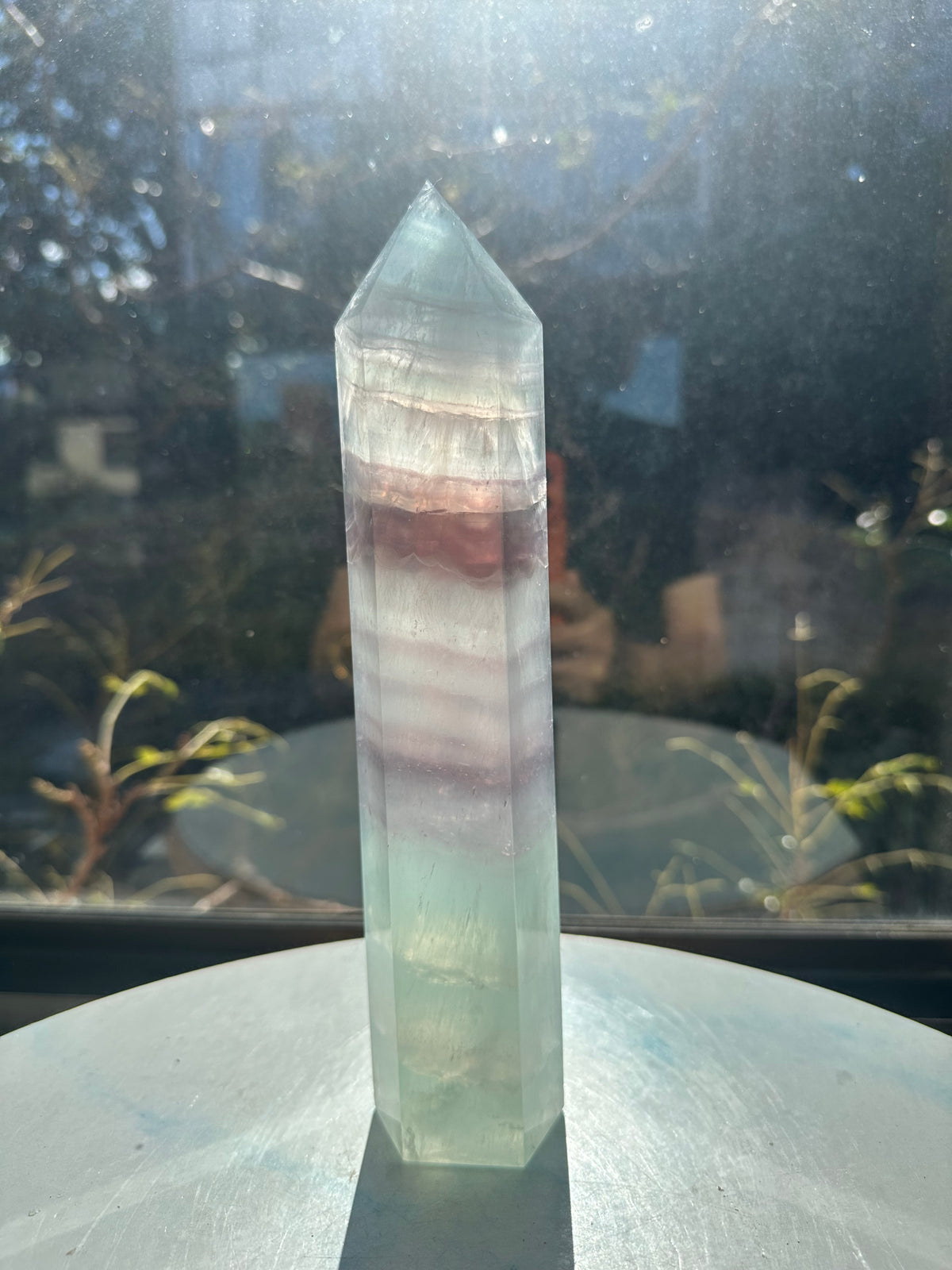  Hand-polished 22cm pale green fluorite pillar with rhythmic growth layers and a serene translucent finish, 1.1kg crystal decor for focused energy.