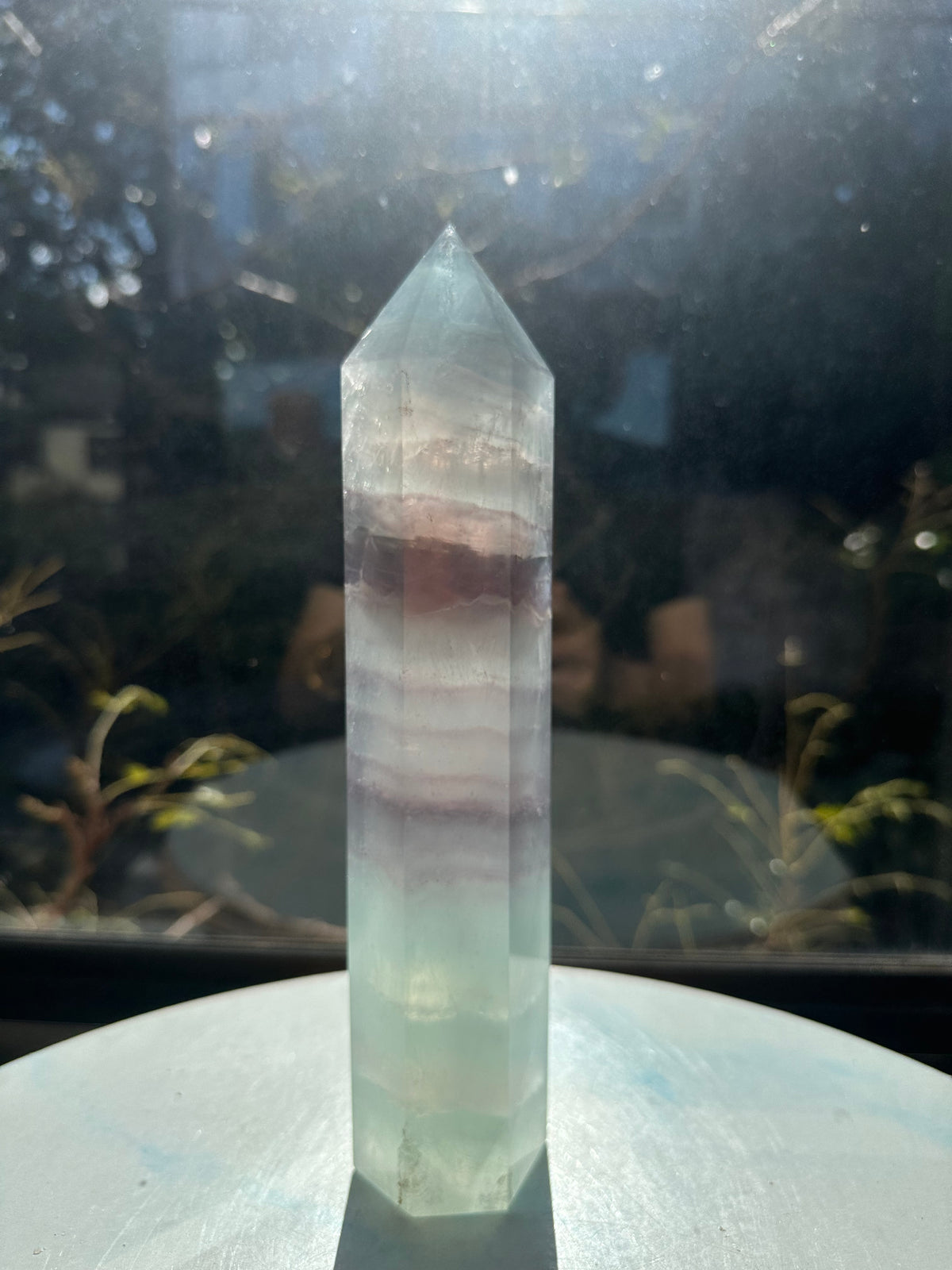  Hand-polished 22cm pale green fluorite pillar with rhythmic growth layers and a serene translucent finish, 1.1kg crystal decor for focused energy.