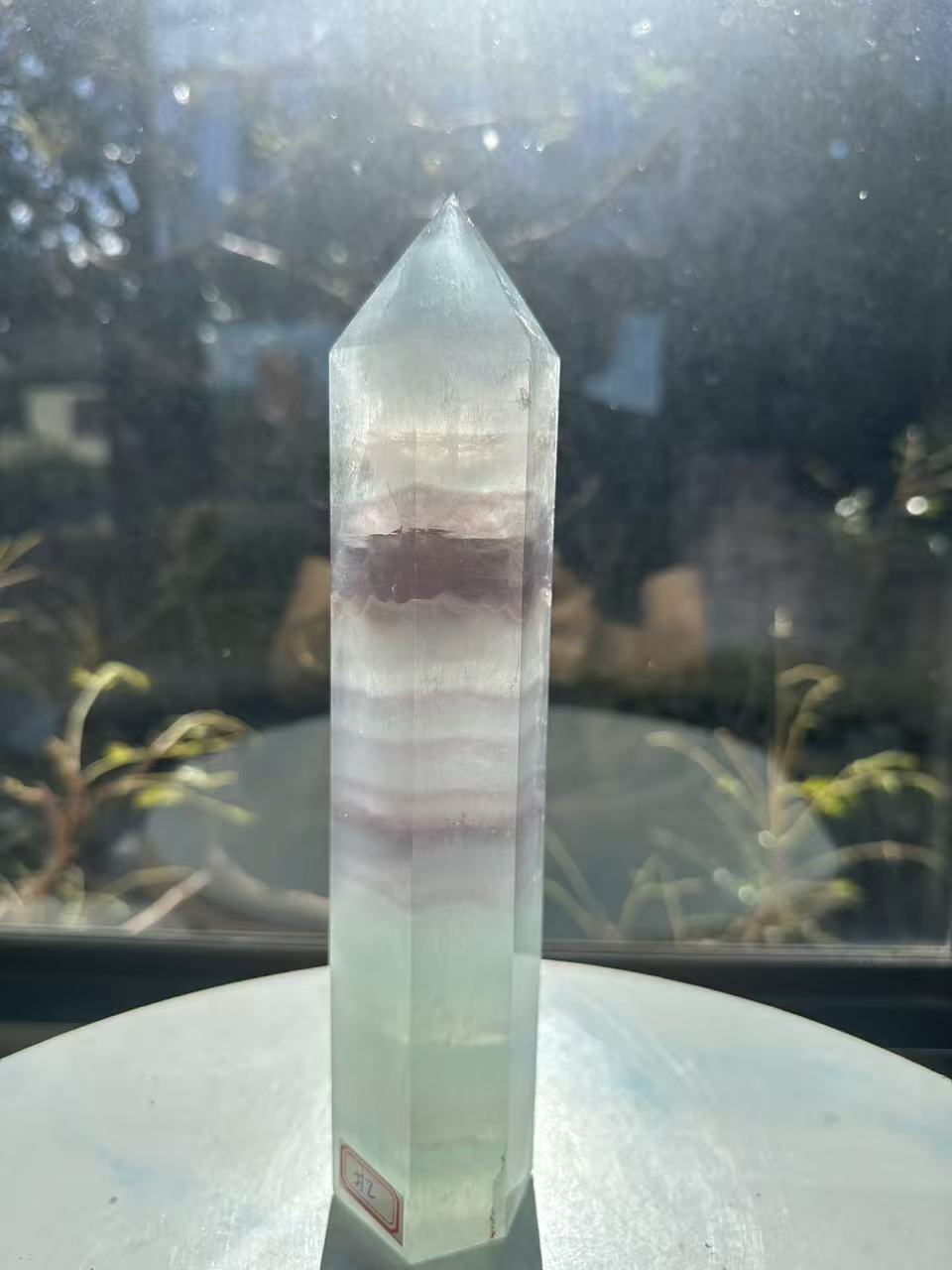  Hand-polished 22cm pale green fluorite pillar with rhythmic growth layers and a serene translucent finish, 1.1kg crystal decor for focused energy.