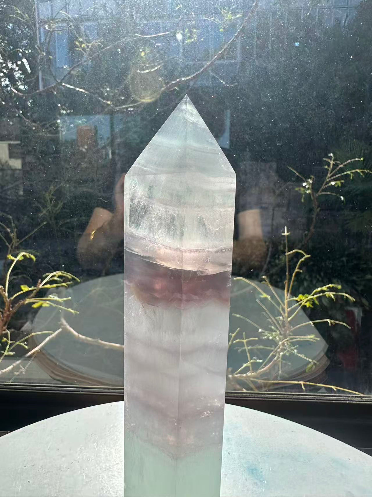 21cm rainbow fluorite tower showing intricate horizontal stripes and phantom structures in light green tones, a unique 0.846kg natural geometric mineral.