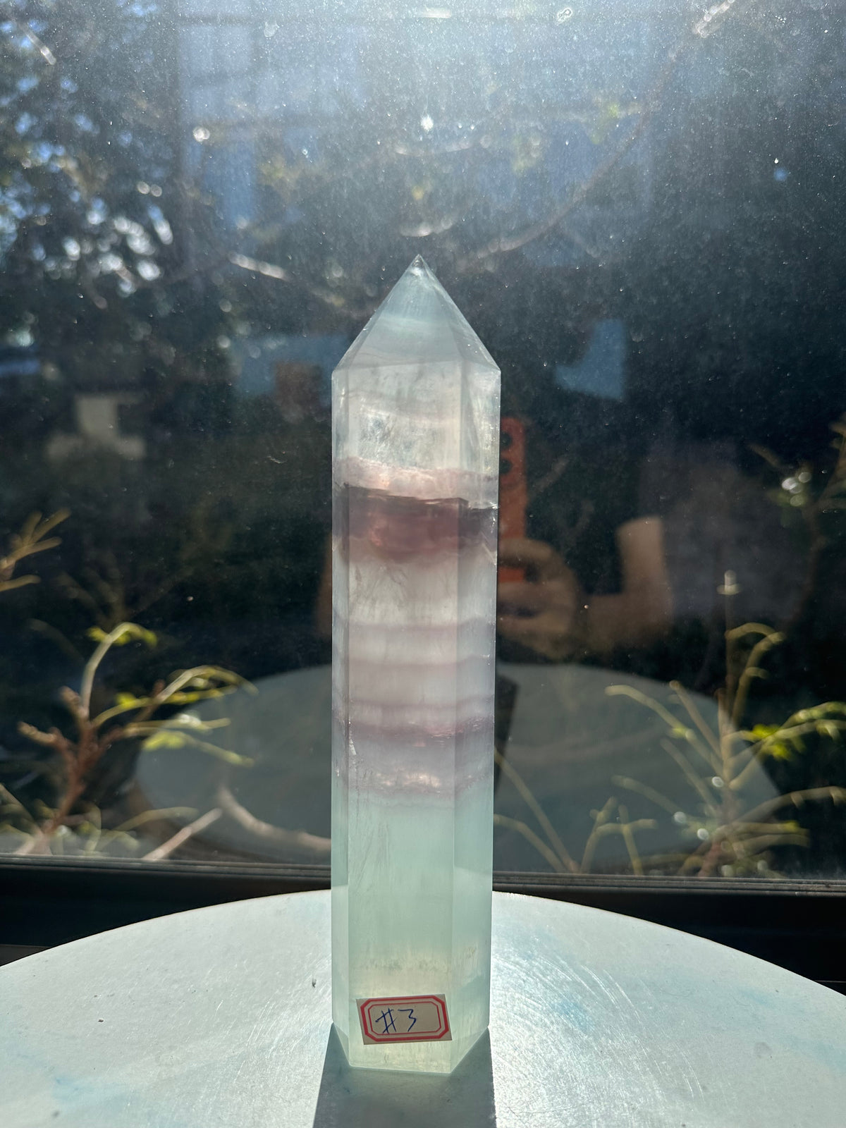 21cm rainbow fluorite tower showing intricate horizontal stripes and phantom structures in light green tones, a unique 0.846kg natural geometric mineral.