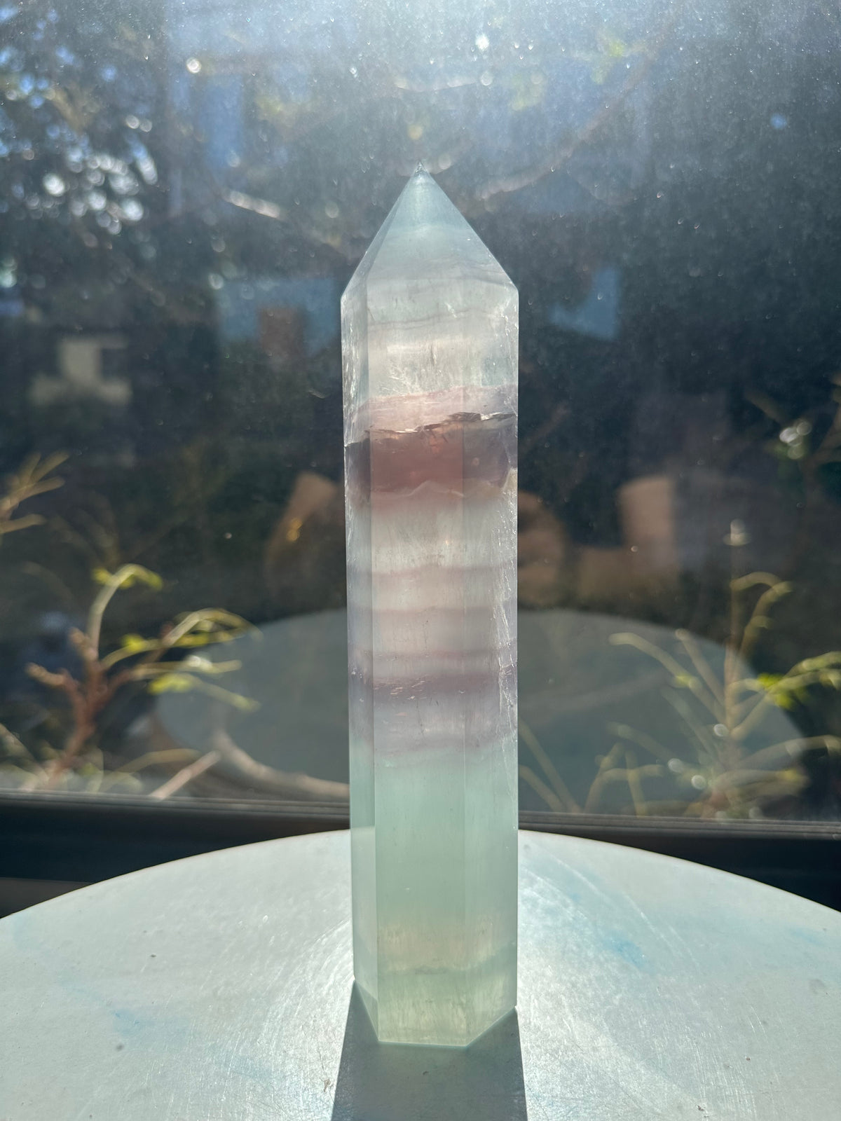 21cm rainbow fluorite tower showing intricate horizontal stripes and phantom structures in light green tones, a unique 0.846kg natural geometric mineral.