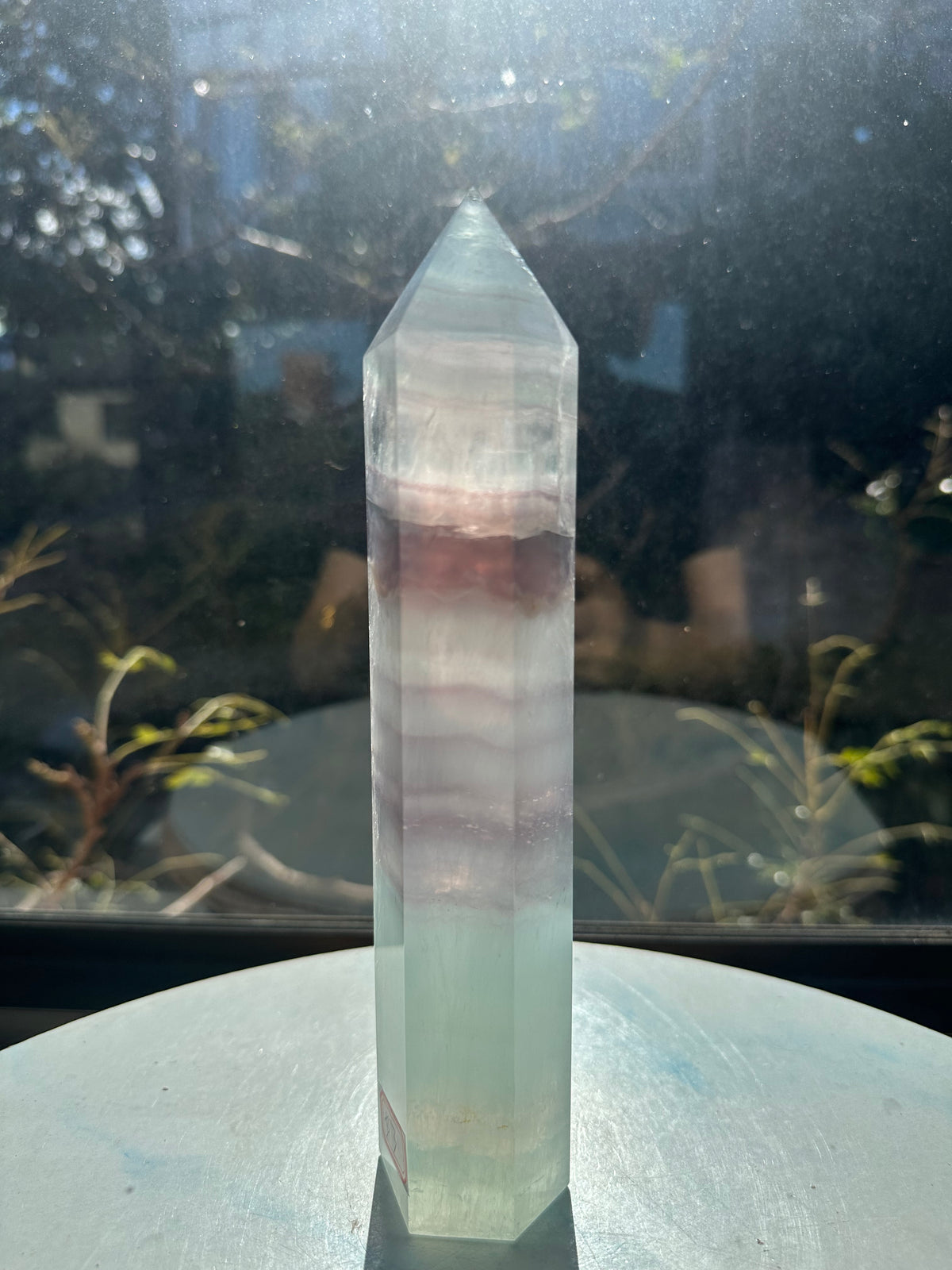 21cm rainbow fluorite tower showing intricate horizontal stripes and phantom structures in light green tones, a unique 0.846kg natural geometric mineral.