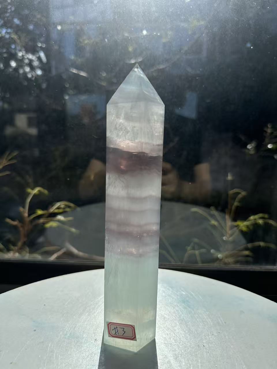 21cm rainbow fluorite tower showing intricate horizontal stripes and phantom structures in light green tones, a unique 0.846kg natural geometric mineral.