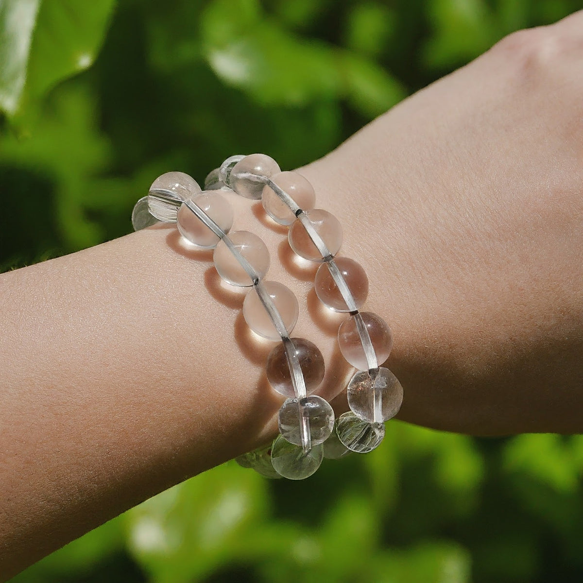 Clear Quartz bead bracelet lifestyle view with polished transparent stones