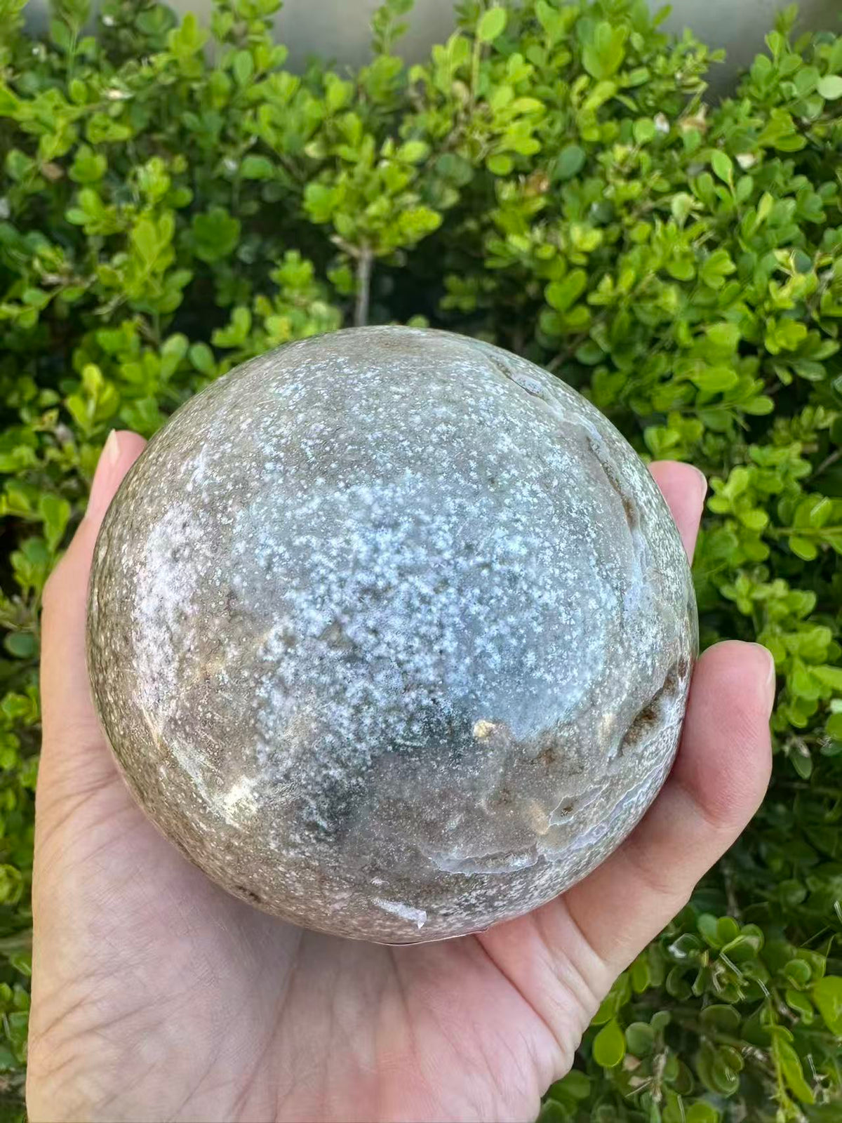 #3,"Large Moss Agate crystal sphere for professional desk decor, 772g, showing deep forest-like moss patterns and sparkling natural druzy by Moon Rituals."