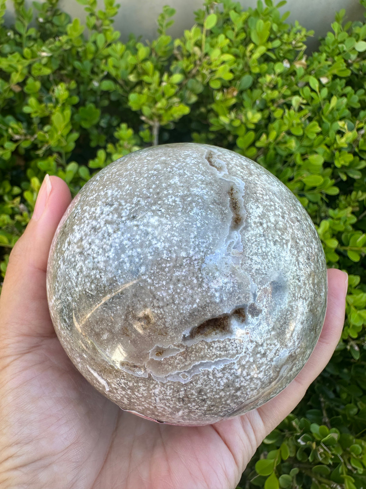 #3,"Large Moss Agate crystal sphere for professional desk decor, 772g, showing deep forest-like moss patterns and sparkling natural druzy by Moon Rituals."