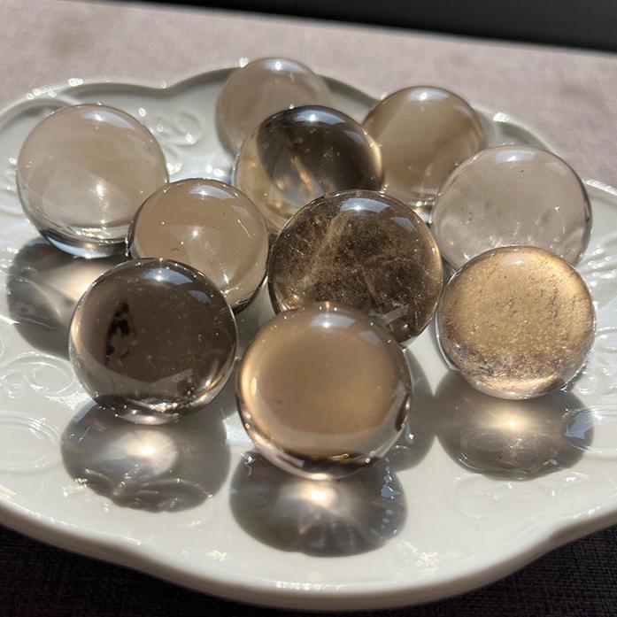 Polished Smoky Quartz crystal ball alternate view with natural colour variation