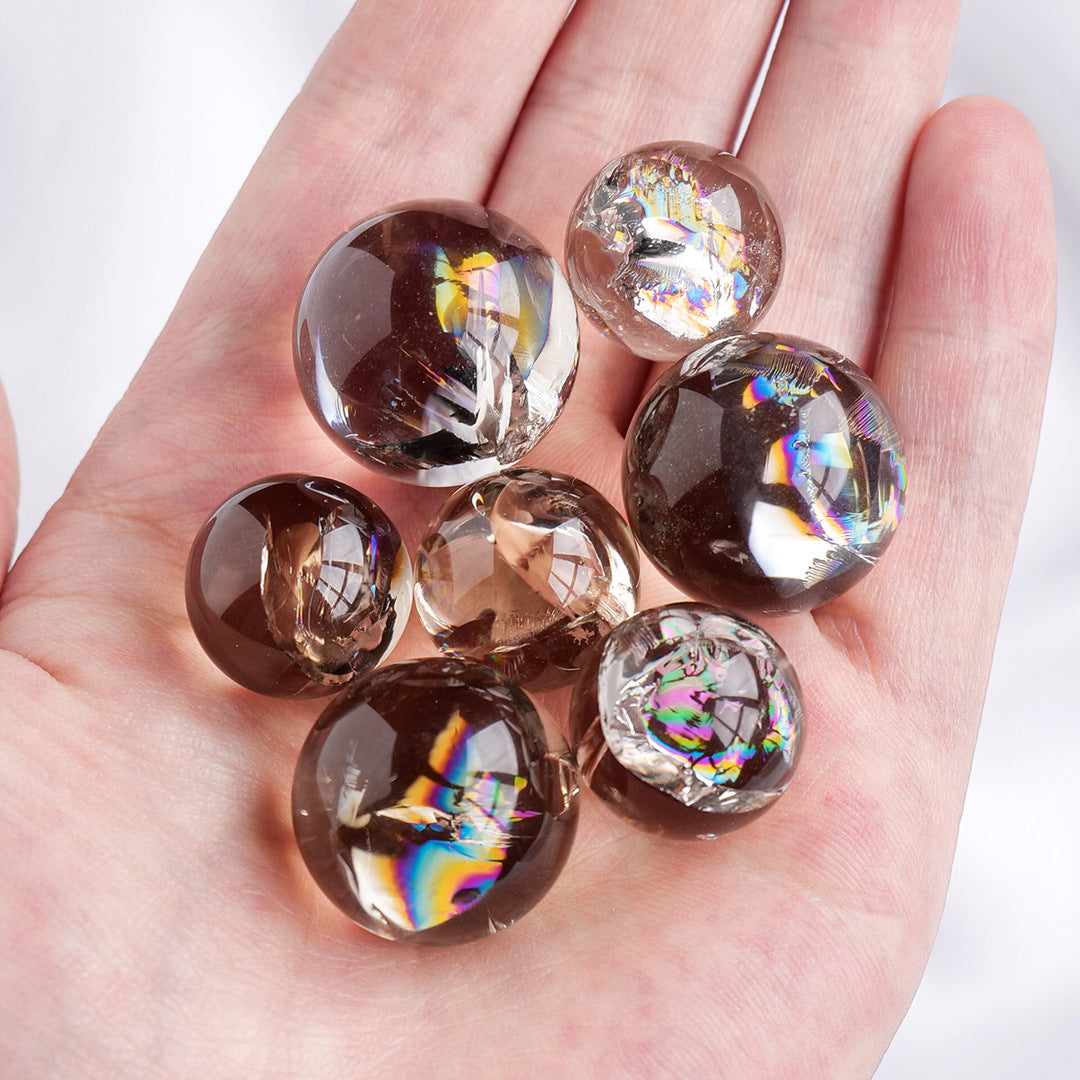 Smoky Quartz sphere with natural smoky-brown colour and internal rainbow feature