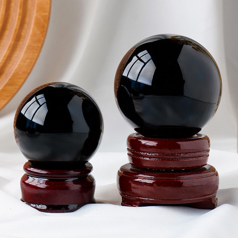 Black Obsidian crystal sphere showing smooth polished surface