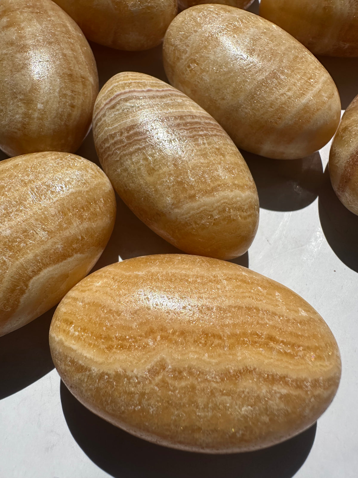 Natural Yellow Calcite palm stone with warm golden colour