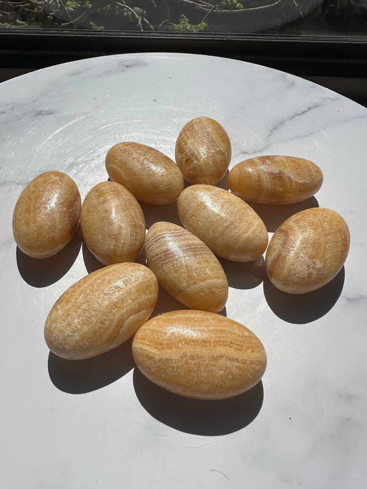 Yellow Calcite palm stone 5–6cm natural polished crystal