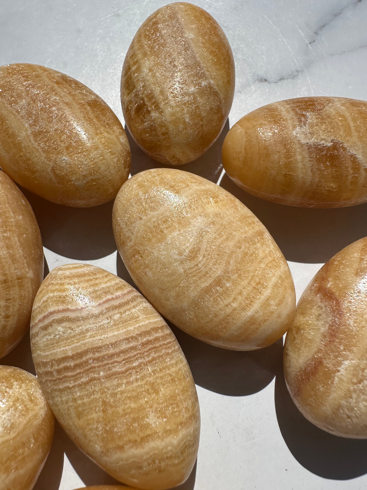 Yellow Calcite palm stone smooth rounded crystal 5–6cm