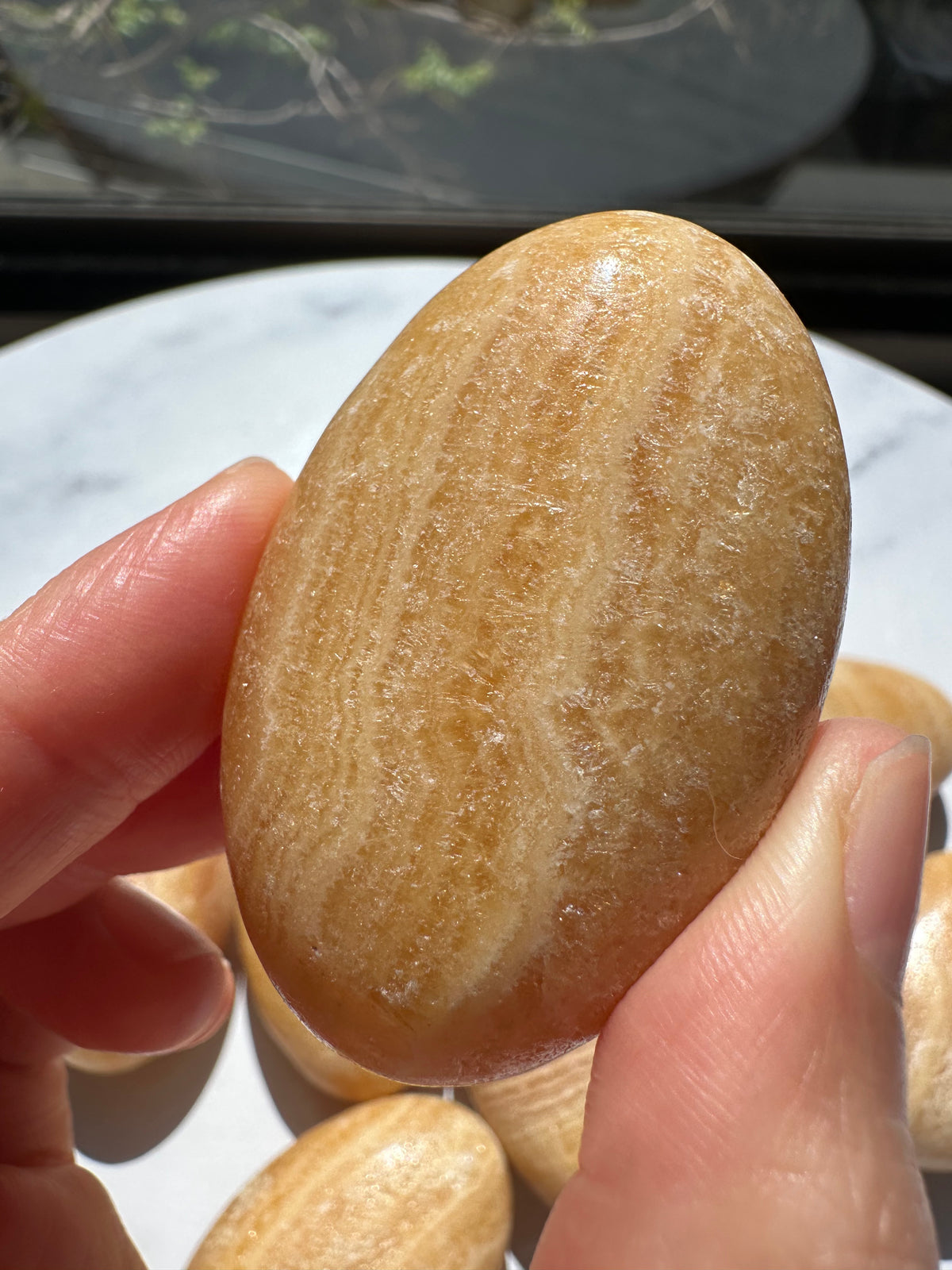 Polished Yellow Calcite hand-sized crystal stone