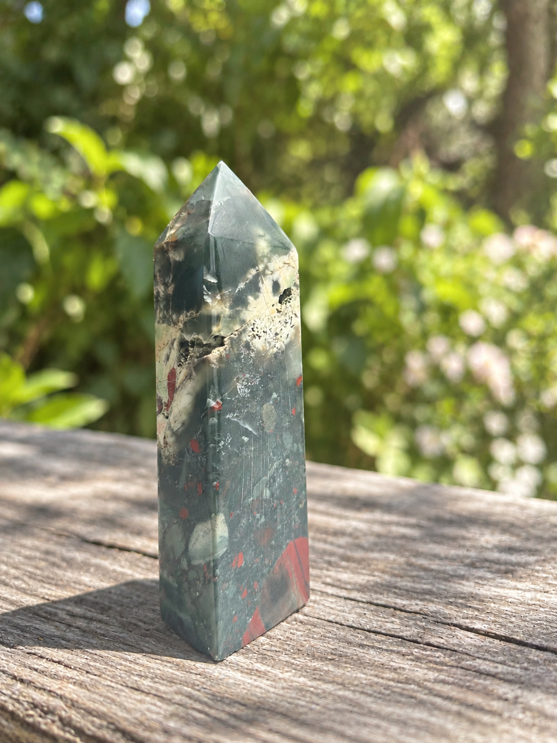 Reverse of exact African bloodstone tower No.2 with grey-green body, dark red patches and a pale band below the polished point