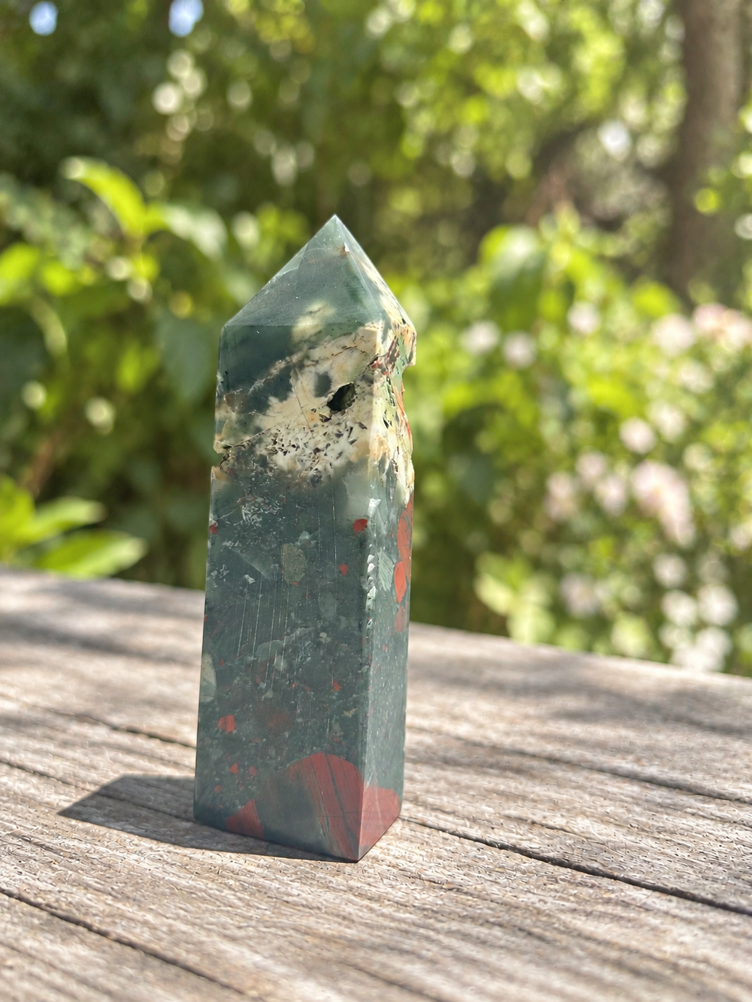 Alternate reverse angle of the 472g bloodstone tower showing pale mineral texture, red patches and visible surface marks