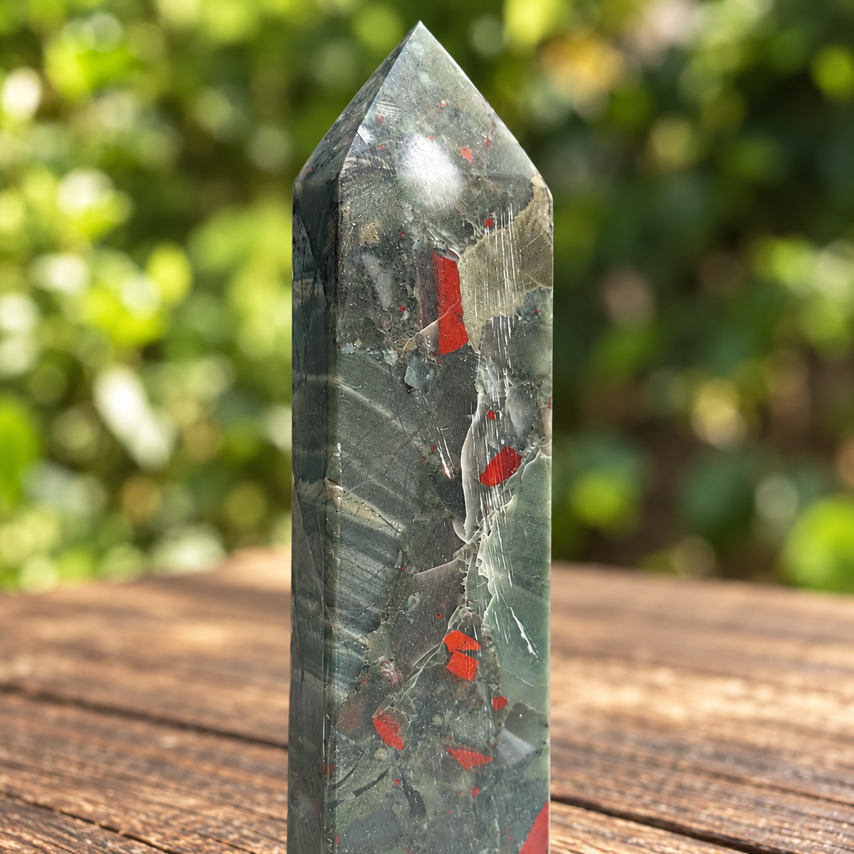 Close-up of No.5 tower upper section with red markings, pale branching veins and parallel surface polishing lines.
