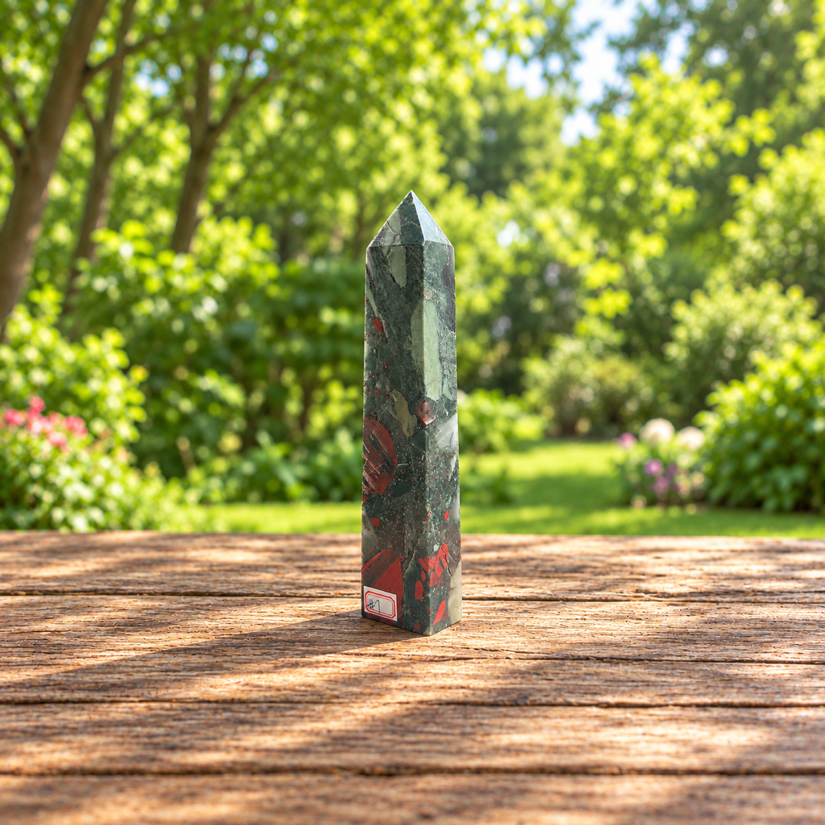 Angled view of No.7 bloodstone tower showing the elongated pale sage marking and red fragments.