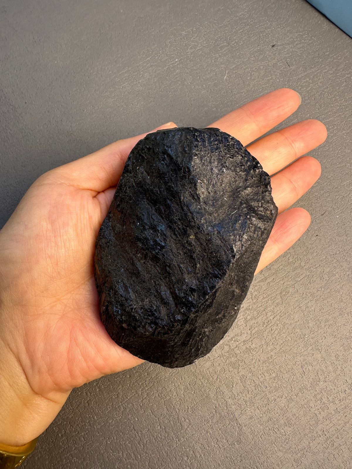 Close view of natural raw black tourmaline crystal