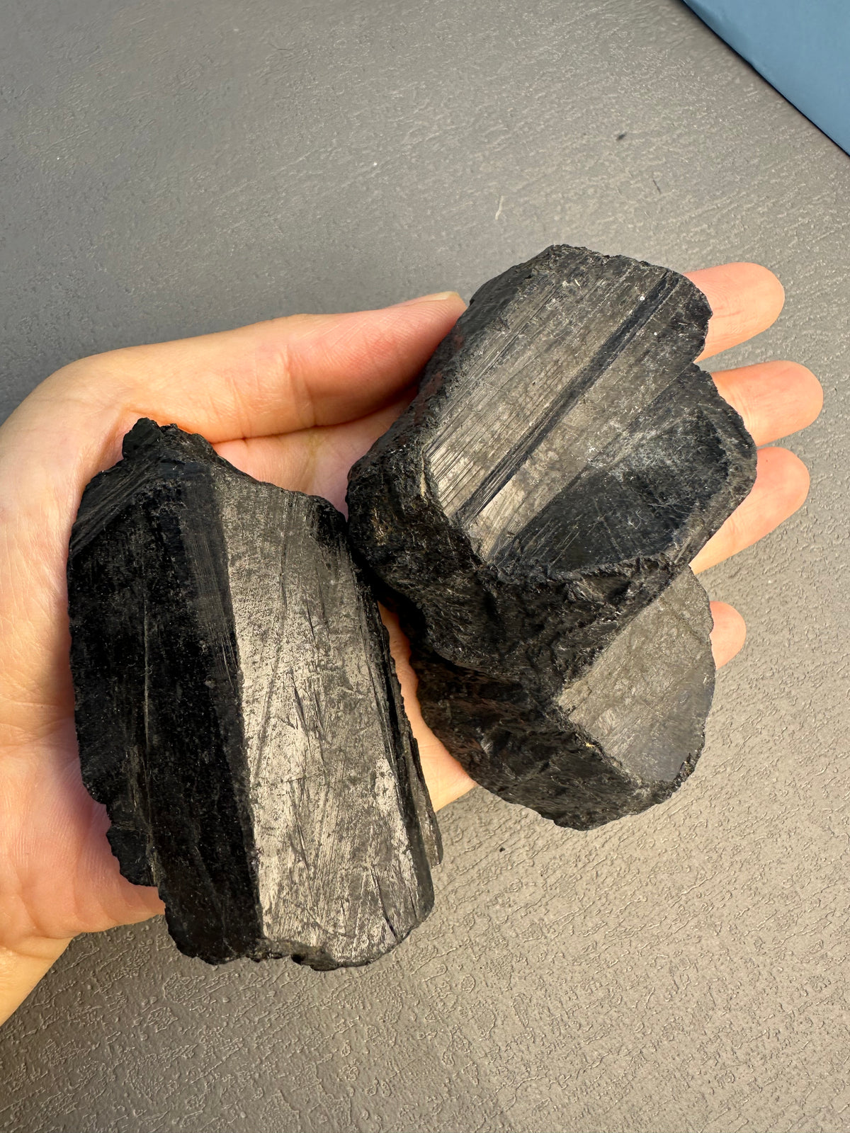 Raw black tourmaline crystal showing lustre and texture