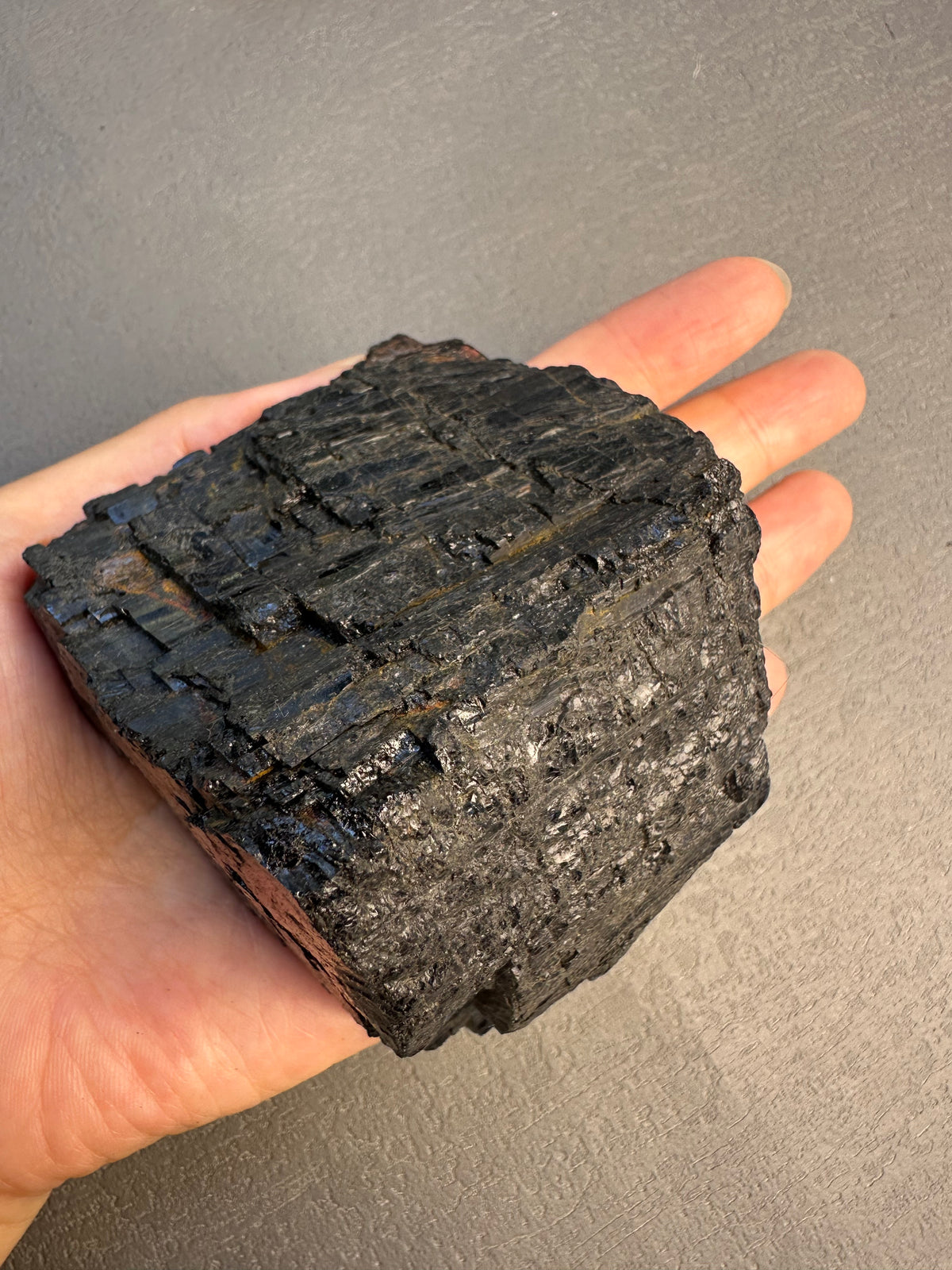 Natural black tourmaline chunk photographed in natural light