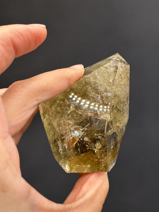Brazilian citrine freeform No.13, 242g, held in hand — view 1