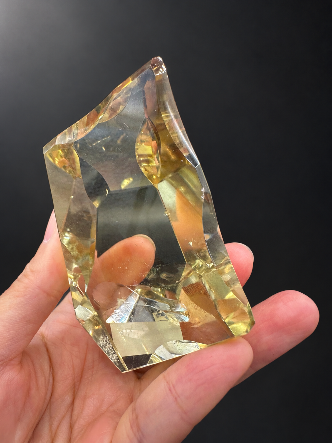 Angled view of fine-cut citrine freeform No.9, approximately 7cm high and 5cm wide
