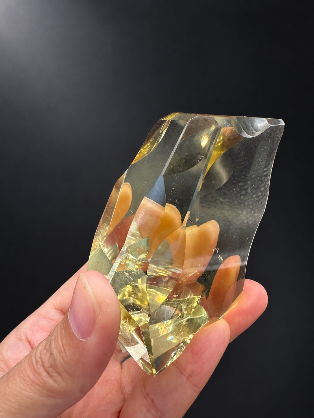 Side view of 187g Brazilian citrine freeform No.9 showing polished curved facets