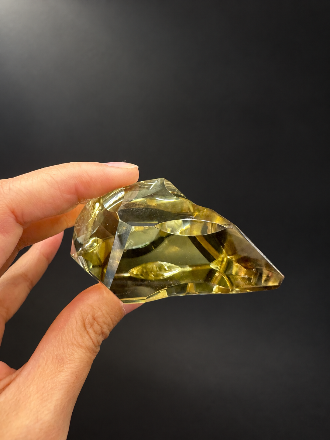 Horizontal handheld profile of Brazilian citrine freeform No.9 showing its cut and thickness