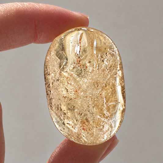Natural Brazilian citrine palm stone with pale lemon-golden colour and internal veils
