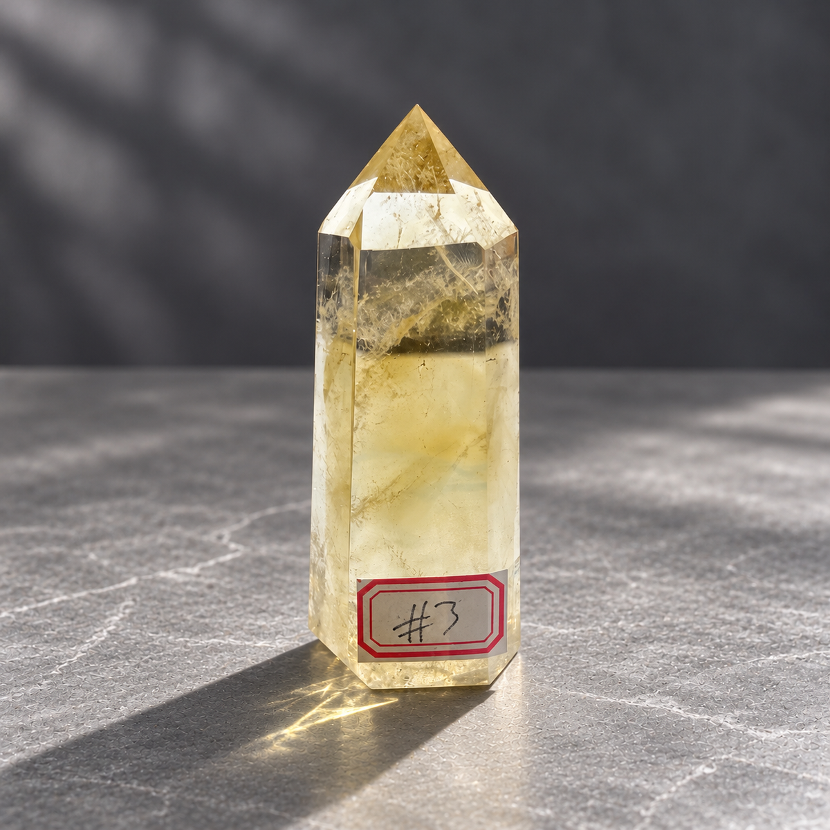 Brazilian citrine tower #3, front view with the original identifying label and natural golden veils